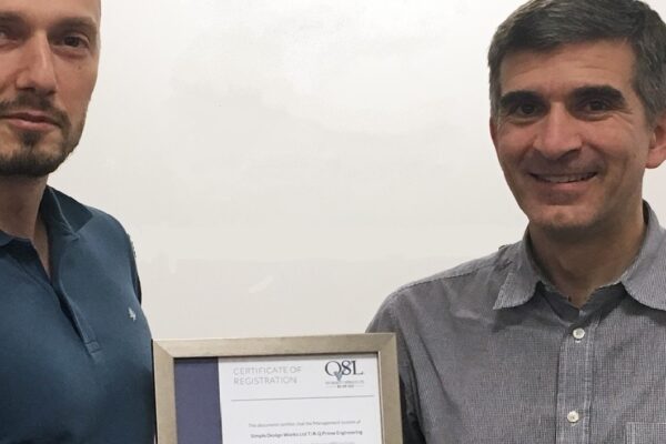 Kristo and Richard with the ISO 9001 certificate showing certified product design
