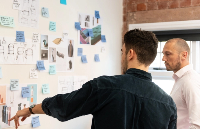Designers at product design agency, Simple Design Works, discuss concepts for a new product