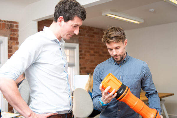 3D printed prototype of redesigned health and safety industrial product with project manager and lead product designer