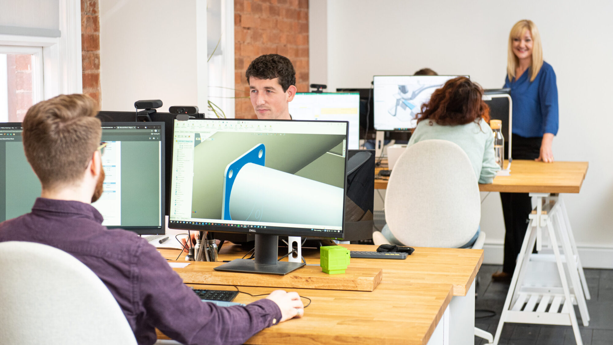 Designers and support team in the product design office in Hereford showing variety of careers