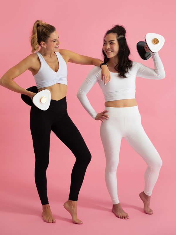 Women with dumbbells product designed for home fitness